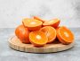 sliced-juicy-fresh-orange-fruits-wooden-plate